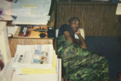 Gunny Williams catching a nap in the office during hell week.. look out for the snake Gunny.