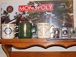 Some coffee cups and shot glasses.  An unopened Marine Monopoly board game in the back ground