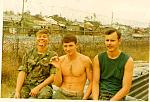 Salty dogs. Old friends in Nam. Can't remember the Marine on the left. Rap in the center, John on right. That's Dog Patch in the background. The...