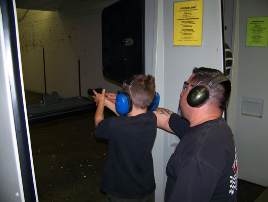 Mateo and his first .22 handgun (he already has a scoped .22 rifle) by Cpl BAJA in Members Gallery