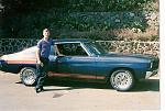 Me standing next to my 1970 chevelle in Hawaii.